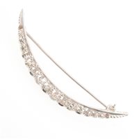 Lot 181 - A diamond set open crescent brooch