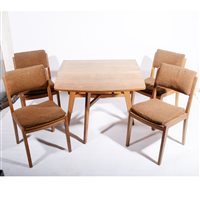 Lot 507 - An English Arts and Crafts style oak dining table and chairs, circa 1950