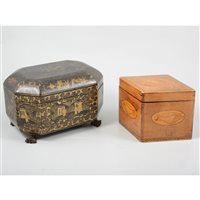Lot 76 - An oriental black lacquer rectangular caddy, together with a satinwood navette shaped caddy (2)