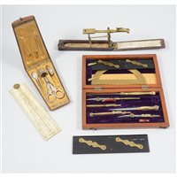 Lot 214 - A brass travelling sovereign balance, original paper instruction label inside, 14cm, rosewood sewing case with satinwood inlay and gilt metal fitted interior