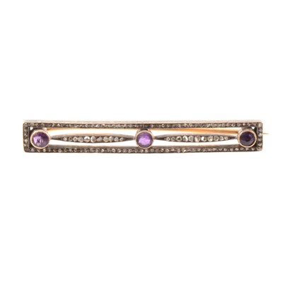 Lot 172 - An amethyst and diamond bar brooch.