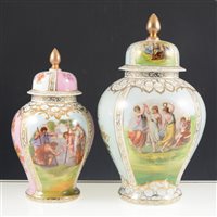 Lot 52 - Dresden darrell harlequin garniture, including a covered vase, transfer printed decoration in the style of Helena Wolfsohn, 29cm.