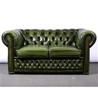 Lot 492 - Traditional style buttoned green leather Chesferfield setttee, width 152cm.