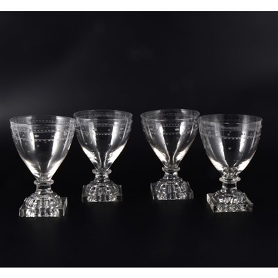 Lot 4 - A near set of twelve George III rummers, engraved with star and bead motifs