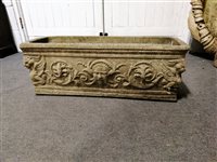 Lot 559 - Two reproduction cast concrete planters, Roman style decoration, width 74cm.