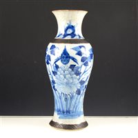 Lot 30 - A Japanese crackle glazed blue and white vase, baluster shape, painted with bird and flowers, 30cm.