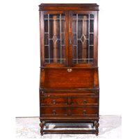 Lot 322 - Oak bureau bookcase.