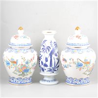 Lot 70 - An early 20th Century enamelled glass vase, and a pair of Italian pottery covered vases.