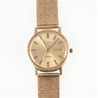 Lot 320 - Rotary - a gentleman's 9 carat yellow gold Automatic 21 jewel wrist watch, circular gold coloured baton dial with centre seconds hand and day/date aperture in a 9 carat gold 32mm case