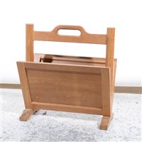 Lot 510 - An oak magazine rack by Robert 'Mouseman' Thompson of Kilburn