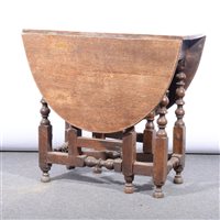 Lot 479 - Small oak gateleg table, oval top, turned supports, conforming rails, 72cm x 106cm.