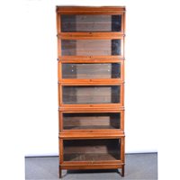 Lot 537 - Globe Wernicke style walnut sectional bookcase