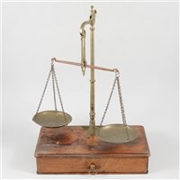Lot 154 - Set of brass and steel beam balance scales, W & T Avery, mahogany platform with a drawer, 26cm and a collection of small weights.