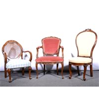 Lot 521 - Reproduction fauteuil in Louis XV style, upholstered in pink dralon, 60cm; a stained walnut nursing chair and an occasional chair, (3).