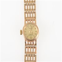 Lot 292 - Rotary - a lady's 9 carat yellow gold bracelet watch, oval dark champagne baton dial in a 9 carat yellow gold case