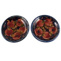 Lot 28 - A pair of William Moorcroft plates, 'Pomegranate' design, circa 1920