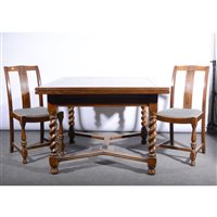 Lot 273 - An oak draw-leaf dining table