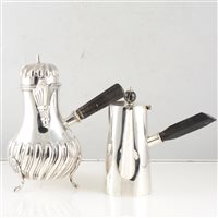 Lot 220 - A Victorian silver chocolate pot by Sibray, Hall & Co (Frederick Sibray & Job Frank Hall), half wrythen fluted body and cover raised on three pad feet with fluted spout