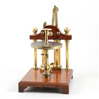 Lot 194 - A 19th century two cylinder vacuum pump, mahogany, lacquered brass and glass.