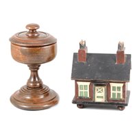 Lot 136 - A Red Ensign on shortened wooden pole, a wooden moneybox in form of a cottage, and a turned wooden chalice