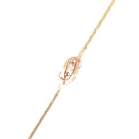 Lot 276 - A yellow metal 2mm wide flexible bracelet with a knot motif to centre set with a brilliant cut diamond and two rubies, length 18.5cms, approximate weight 6.6gms.