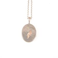 Lot 287 - A silver coloured oval locket 46mm x 37mm with applied rose metal bird, silver coloured belcher link chain 80cm long, no fastener.
