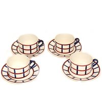Lot 56 - French Pottery teaware, including six cups, saucers and side plates, and a pair of oval dishes