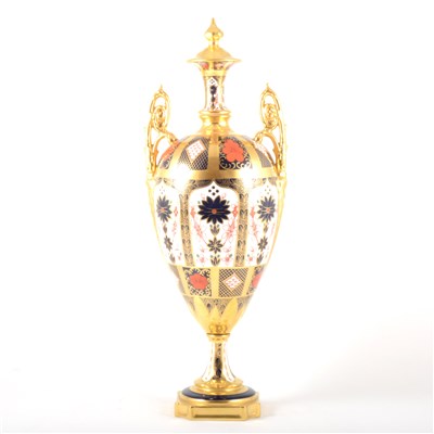 Lot 23 - An Old Imari pattern twin handled vase and cover, by Royal Crown Derby.