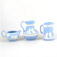 Lot 30 - Three Wedgwood blue Jasperware jugs