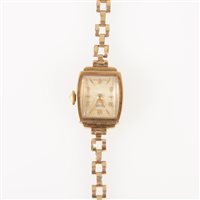 Lot 293 - Rotary - a lady's 9 carat yellow gold bracelet watch, rectangular light champagne baton dial with quarter arabics in a 9 carat yellow gold case