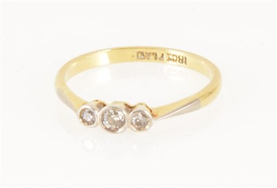Lot 251 - A diamond three stone ring, the old brilliant cut stones collet set in a yellow and white metal traditional three stone mount, shank marked 18ct Plat, gross weight approximately 1.7gms, ring size L.