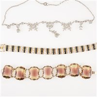 Lot 312 - A hallmarked silver-gilt bracelet set with alternating bands of three princess cut synthetic white stones and three square cut blue stones