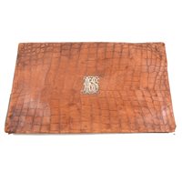 Lot 80 - An early 20th Century desk top stationery folder with crocodile cover produced in Vienna having a silver coloured monogram "AHS" to centre