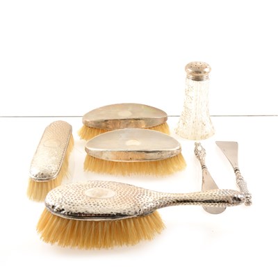 Lot 220 - A silver topped glass dredger by John Grinsell & Sons, Birmingham 1907, a pair of dressing table silver backed brushes, London 1921, two more brushes, button hooks and shoe horns etc