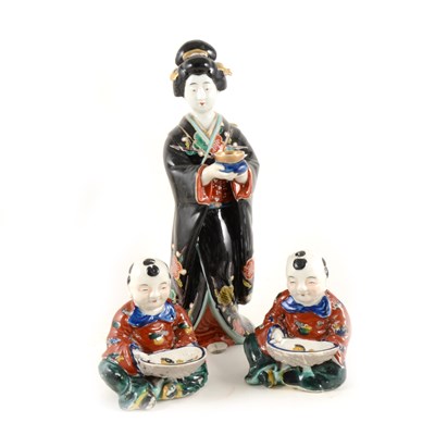 Lot 47 - Three Japanese pottery figures.