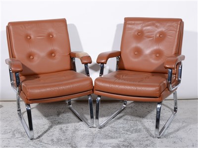 Lot 687 - Two leather and chrome framed armchairs, by Verco