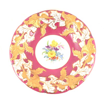 Lot 7 - A Meissen hand painted dish with floral centre, puceborder with gilded acanthus leaf decoration around scalloped rim, impressed C113, 30cm