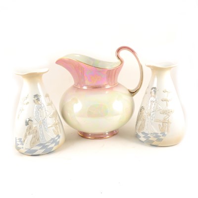 Lot 43 - A pair of Spanish porcelain vases decorated with Japanese scenes, 23cm high, and a large Kiralpo Ware lustre jug, pink neck and base, 28cm high.