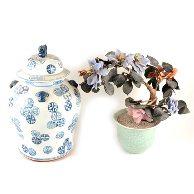 Lot 74 - Chinese hard stone tree plant, celadon jardinière base, 35cm; and a Chinese blue and white covered jar. (2).