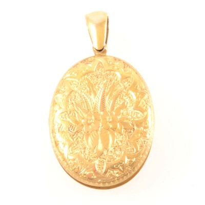 Lot 226 - A Victorian yellow metal oval locket.