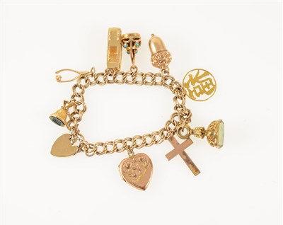 Lot 264 - A 9 carat yellow gold double curb link bracelet with padlock fastener, nine charms attached