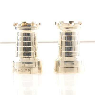 Lot 234 - A pair of Victorian silver peppers by Horace Woodward & Co (Edgar Finley & Hugh Taylor) in the form of castellated towers