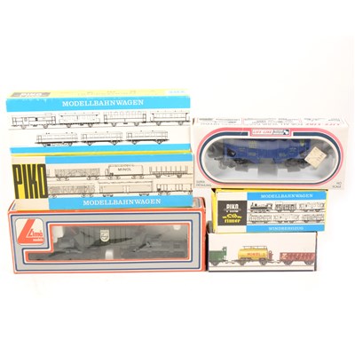 Lot 76 - Thirty HO gauge model railway rolling stock, wagons, petrol tanks etc by Piko and others makers.