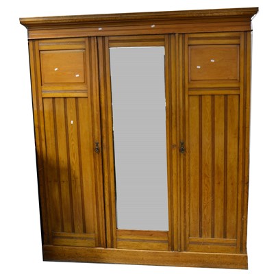 Lot 322 - Victorian stained walnut triple wardrobe.