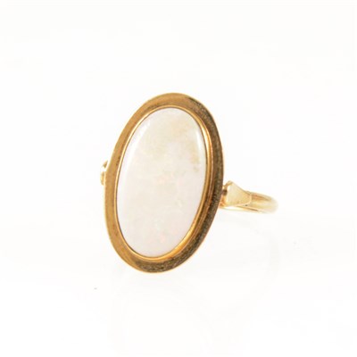 Lot 255 - An opal dress ring, the oval cabochon cut stone.