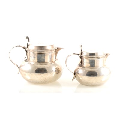 Lot 143 - Two graduating silver beer jugs, Goldsmiths & Silversmiths Co Ltd, London 1935