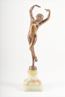 Lot 144 - An Art Deco patinated art metal figure, signed Vivian.