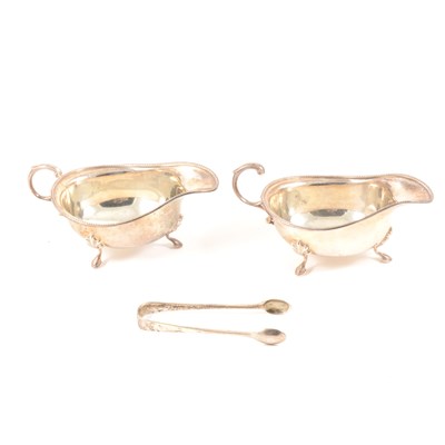 Lot 182 - Two silver sugar bowls by Elkington & Co Ltd, Birmingham 1947. a pair of sugar tongs, London 1891.