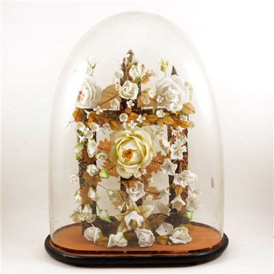 Lot 105 - Porcelain head climbing rose arrangement, ...