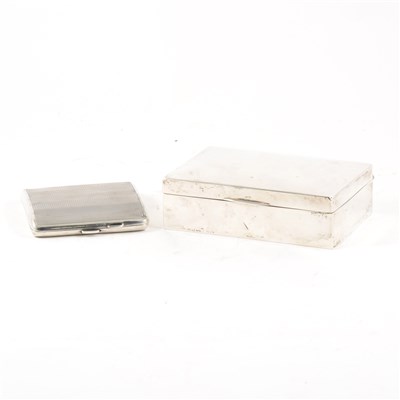 Lot 171 - A silver cigarette box by Walker & Hall, rectangular with slightly domed lid, cedarwood lined, width 12.5cm, Birmingham 1942, and a cigarette case by Charles S Green & Co, engine-turned